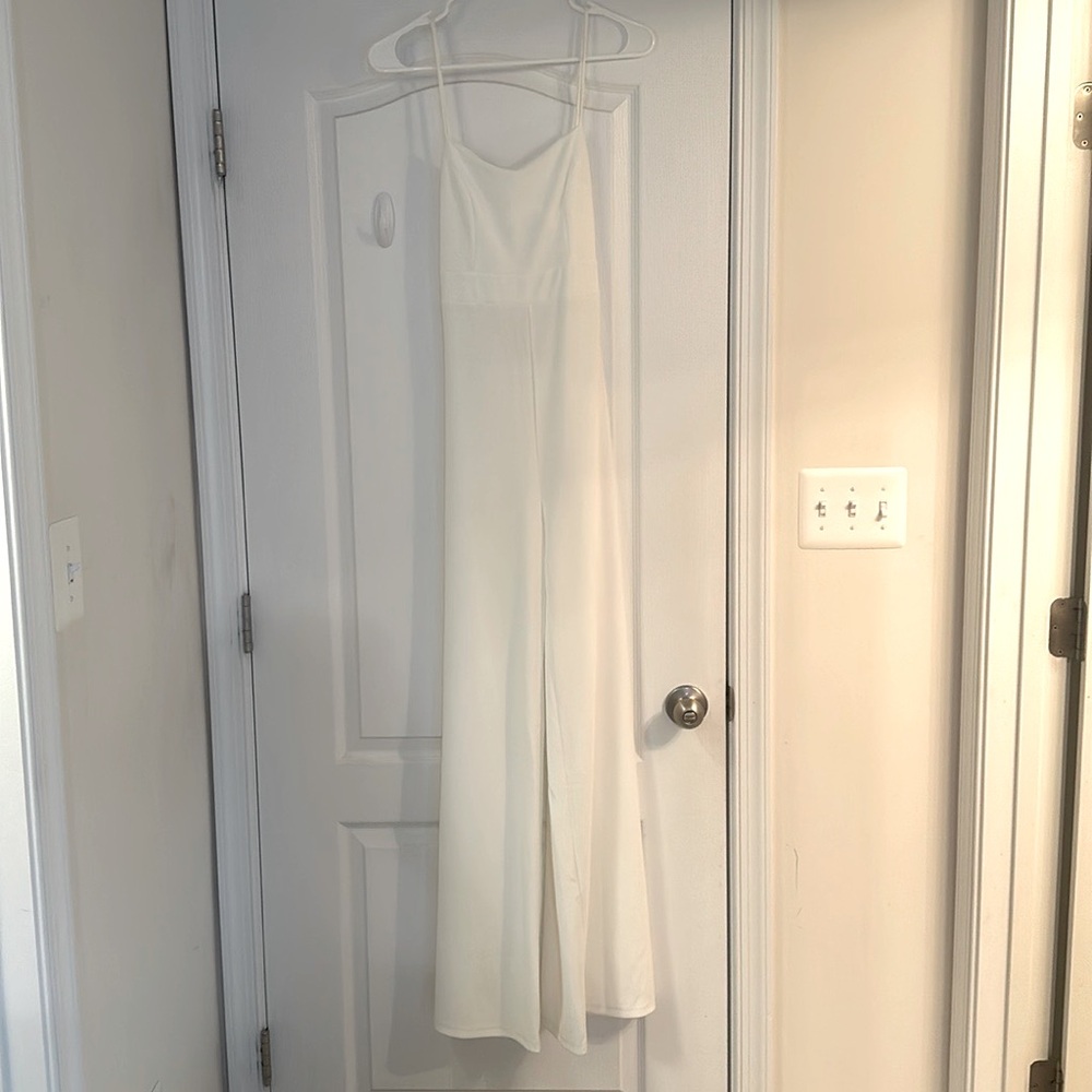 I am selling a white cream colored jumpsuit